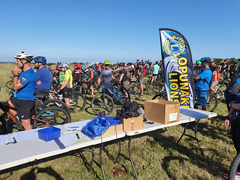 Riders gathered with their bikes at the Ōpunakē Lions Mountain to Sea start line